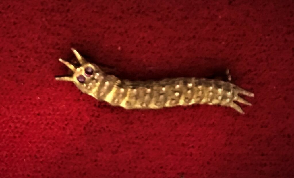Lester Schrneks Caterpillar pin with redyes
