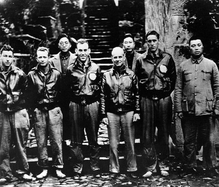 Lt. Col. Doolittle with members of his flight crew and Chinese officials in China after the attack. From left to right: Staff Sgt. Fred A. Braemer, bombardier; Staff Sgt. Paul J. Leonard, flight engineer/gunner; Chao Foo Ki, secretary of the Western Chekiang Province Branch Government. 1st Lt. Richard E. Cole, copilot; Doolittle; Henry H. Shen, bank manager; Lt. Henry A. Potter, navigator; General Ho, director of the Branch Government of Western Chekiang Province.